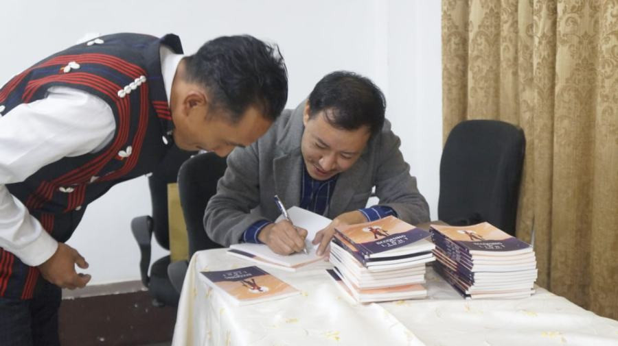 The author Allan Aley at the book signing after his debut book ‘Becoming the Light’ release event held at Hotel Saramati, Dimapur on November 27. (Morung Photo)